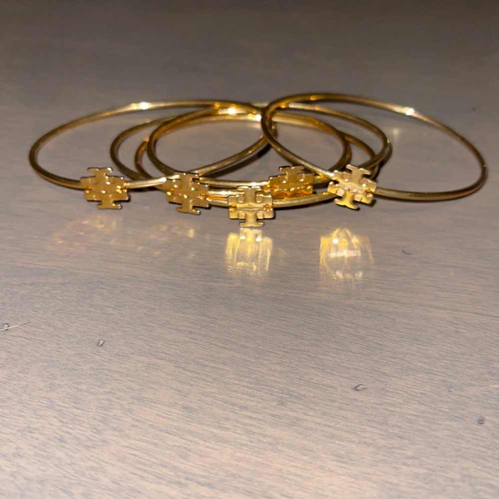 Bundle of 5 Tory Burch bangle bracelets.
